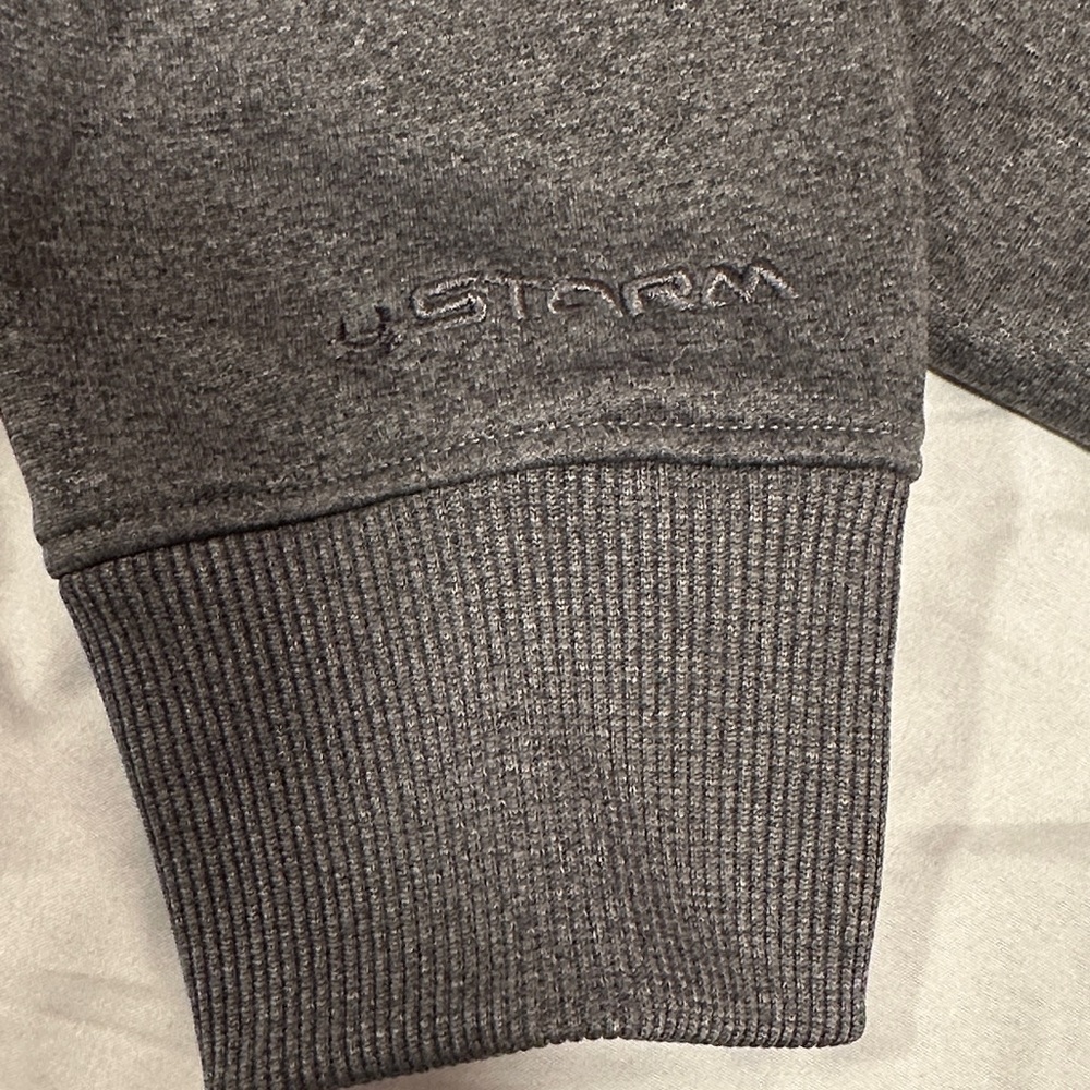 Under Armour Storm Semi Fitted Charcoal Gray Hoodie with Blue and Yellow logo. - Picture 3 of 7